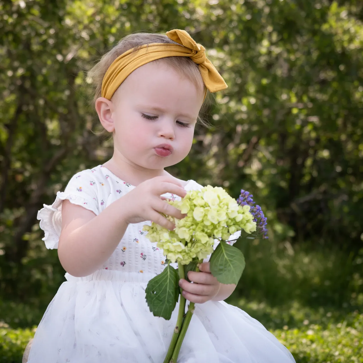 Toddler Girl with Flowers