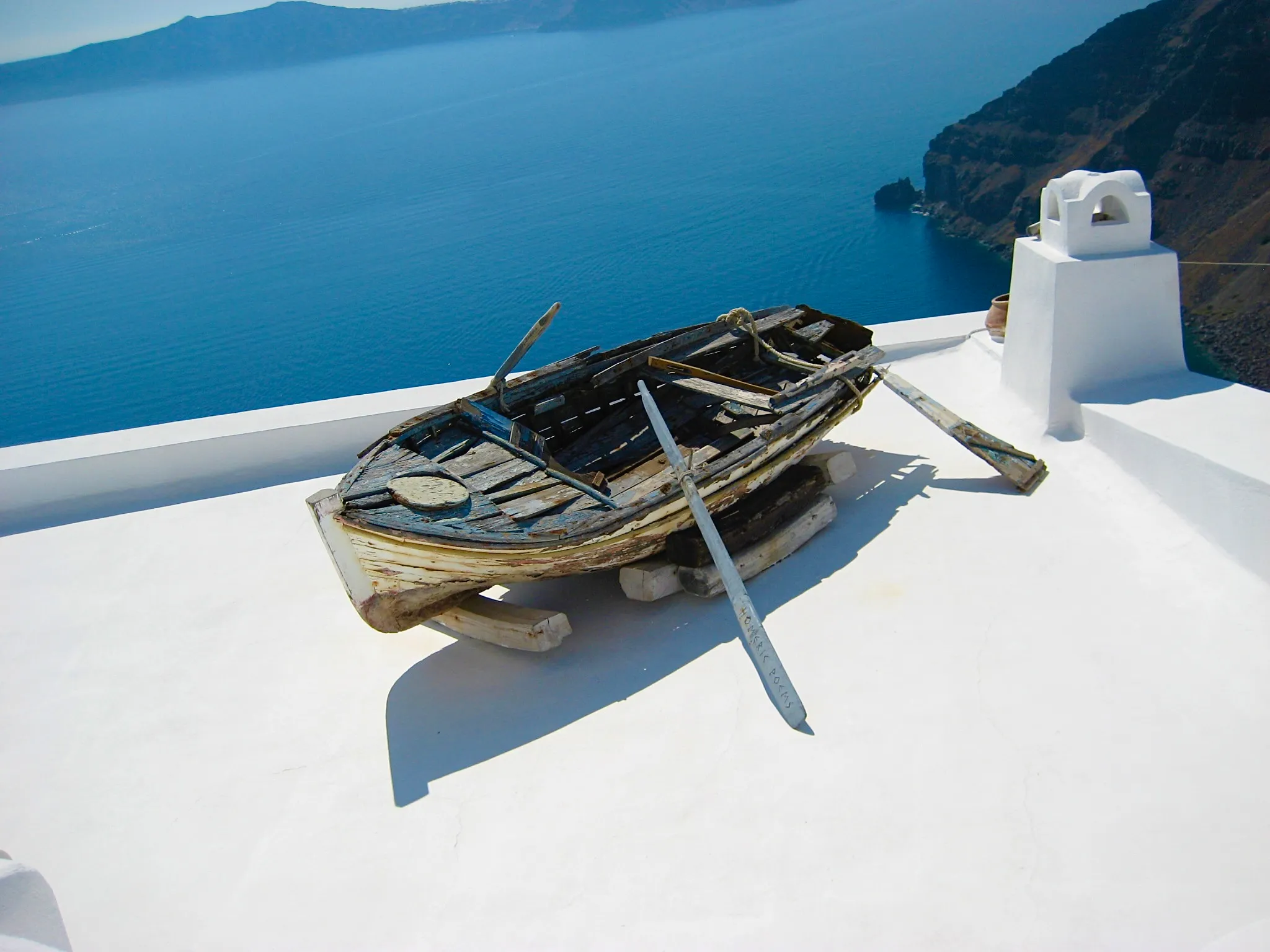Weathered boat used for decoration in Santorini