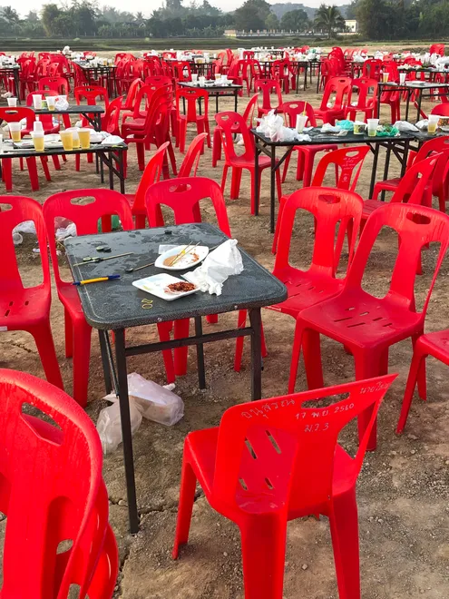 Plastic chairs and garbage after the party