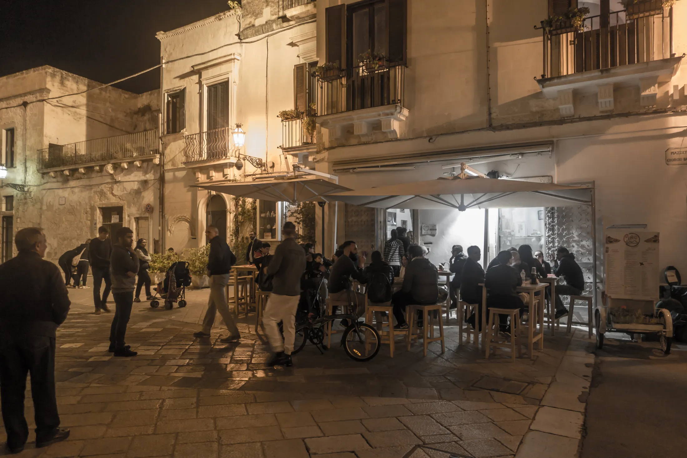 Outside tables at night. Ciro, Pizza restaurant, Lecce, Salento, Apulia, Italy.