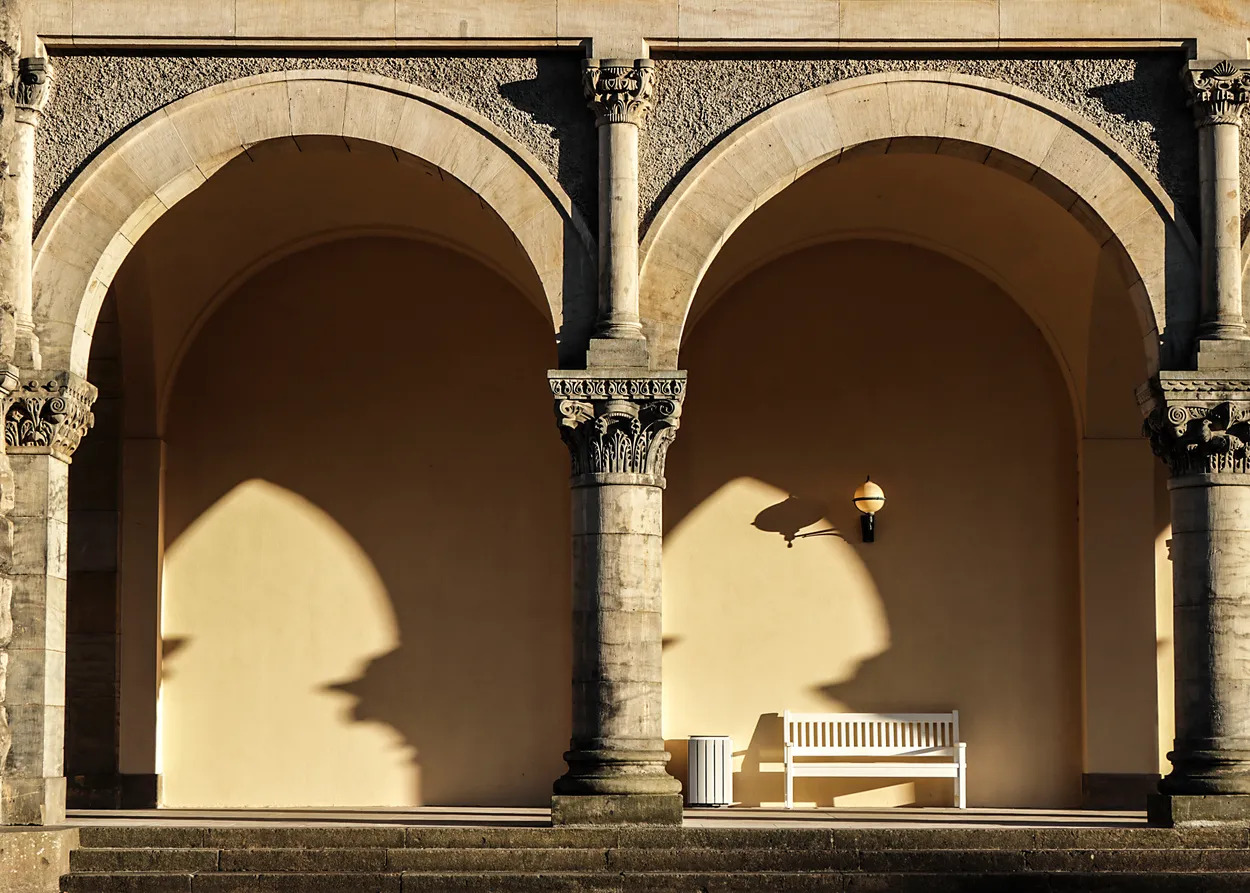 Empty benc under arches