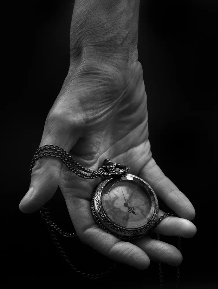 Hand Holding Pocketwatch