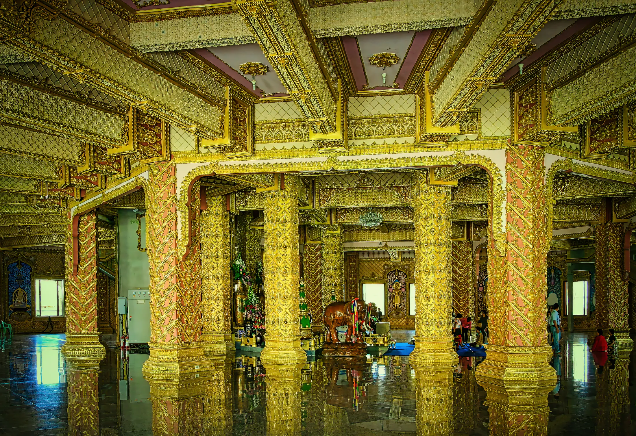 Inside a circular temple with countless details and decorations