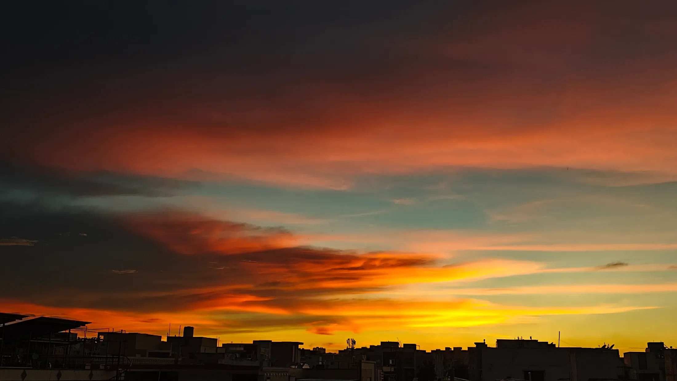 Painted Skies: A Sunset Masterpiece Above the City