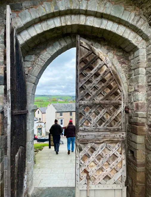 Walking out of the gates of Hay Castle, Wales