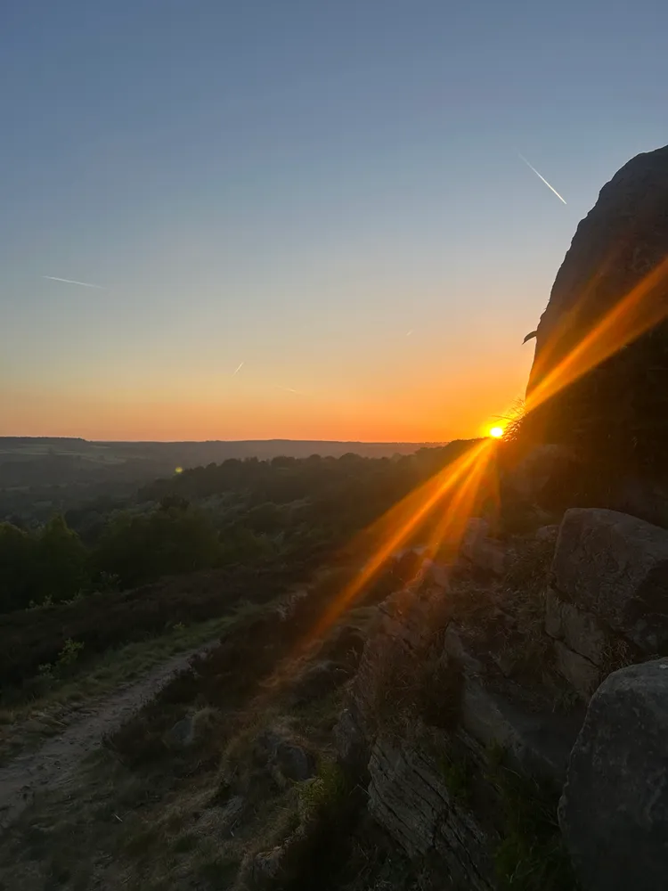 Sunset behind a rock