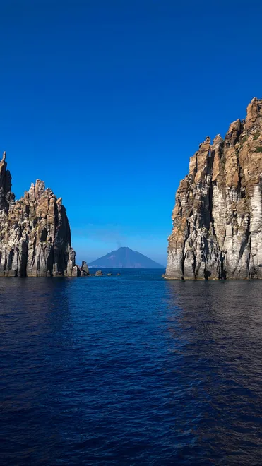 Stromboli peak-a-boo between the cliffs of Basiluzzo.