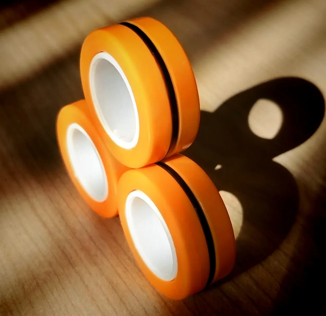 Orange finger fidget spinners