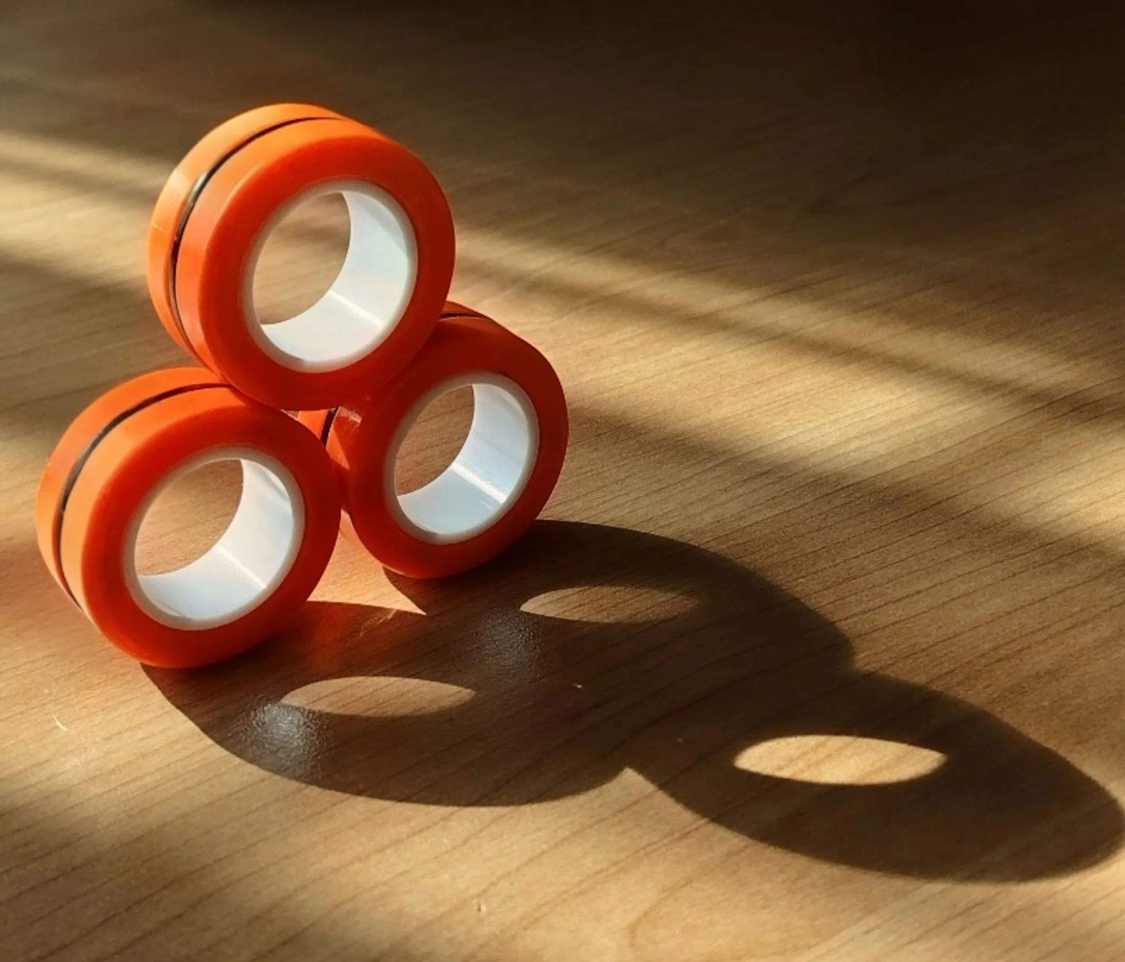 Orange finger fidget spinners