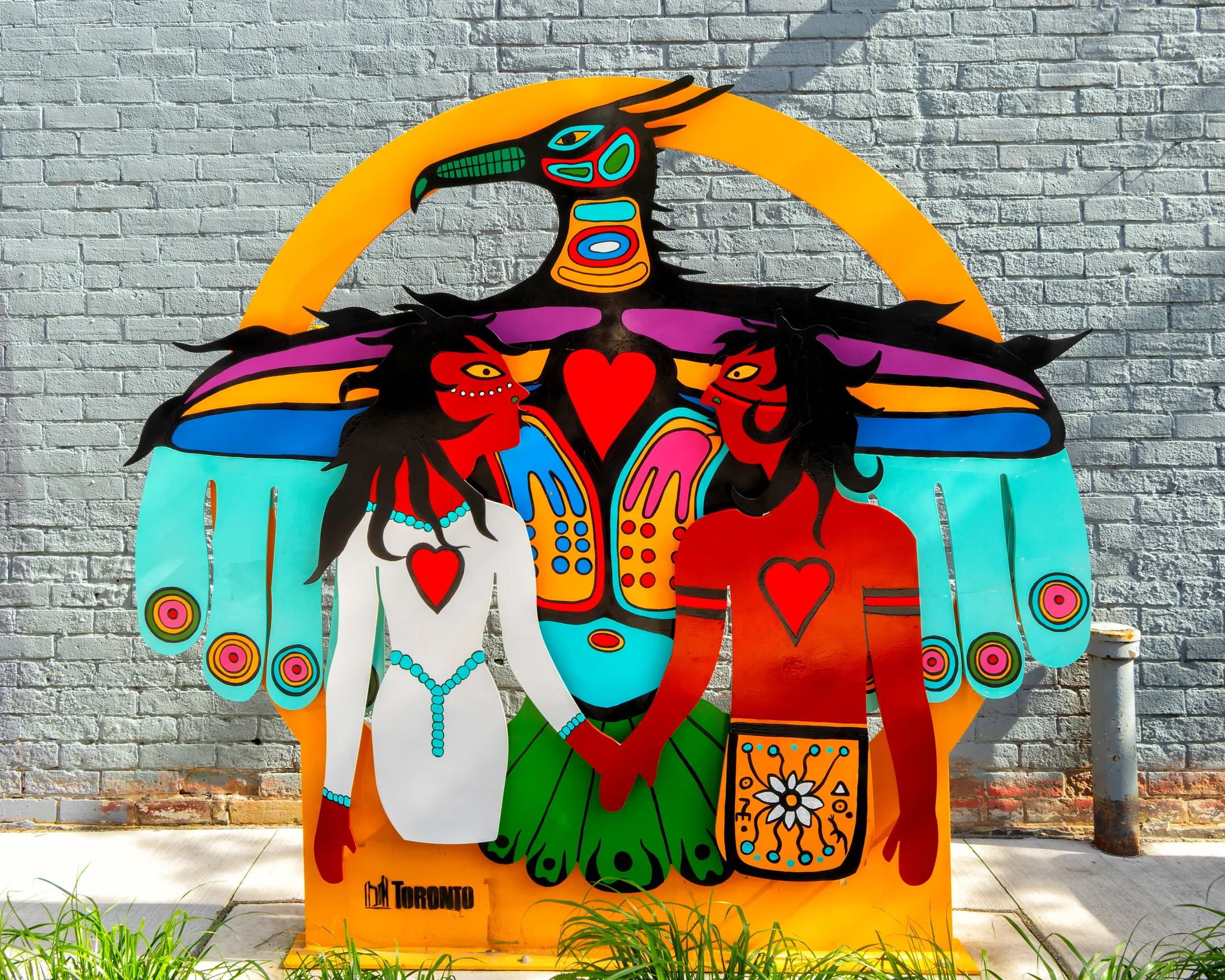 Cutout Style Sculpture in Front of a Wall