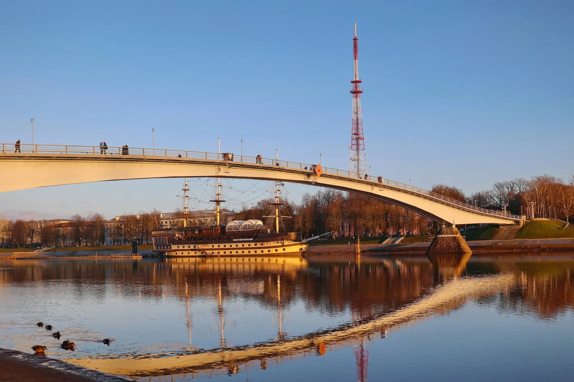 Water Vessels Sailing Under Bridges