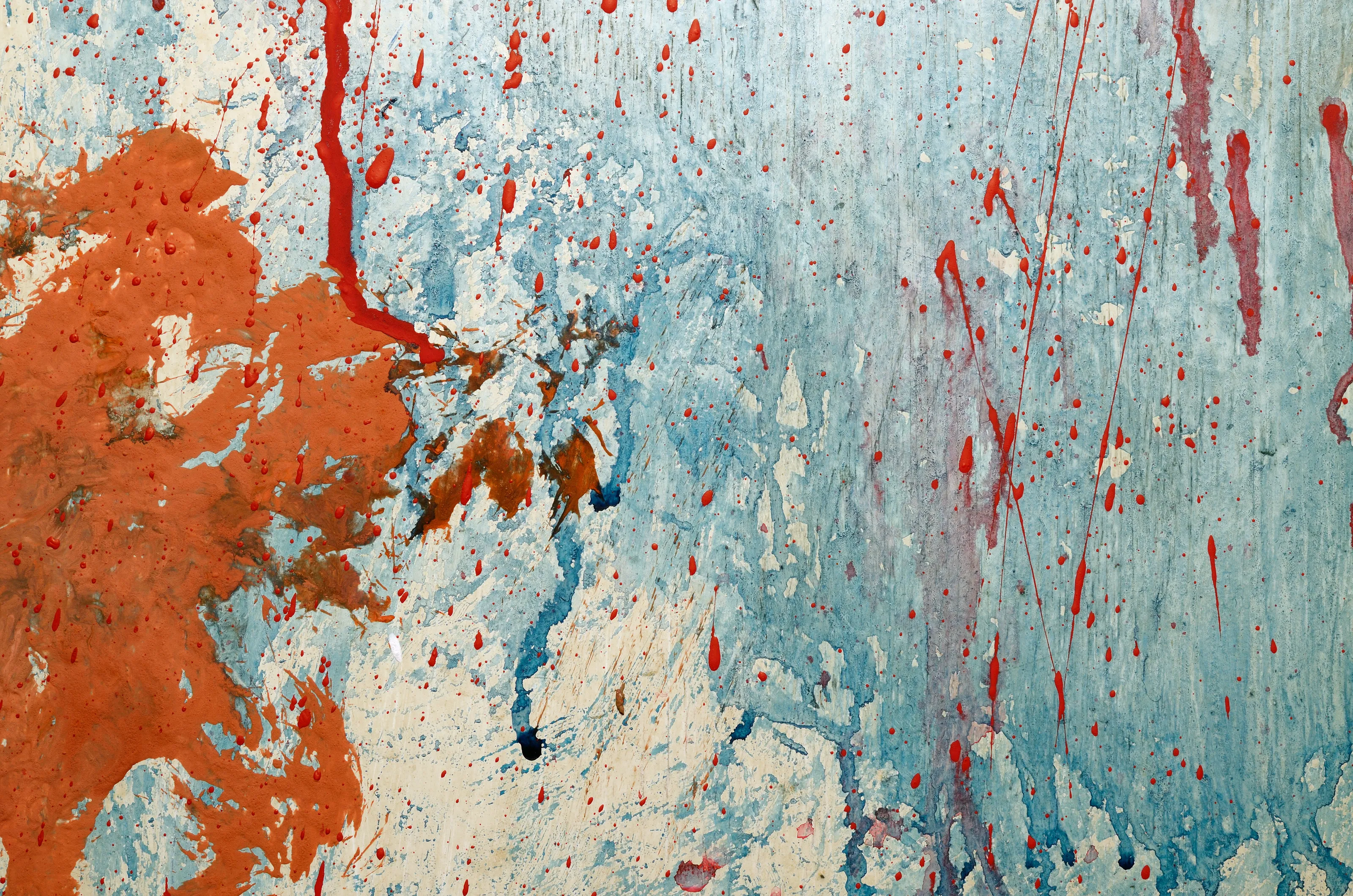 Red blody splashes on grunge wall. Abstract  backdrop for your design