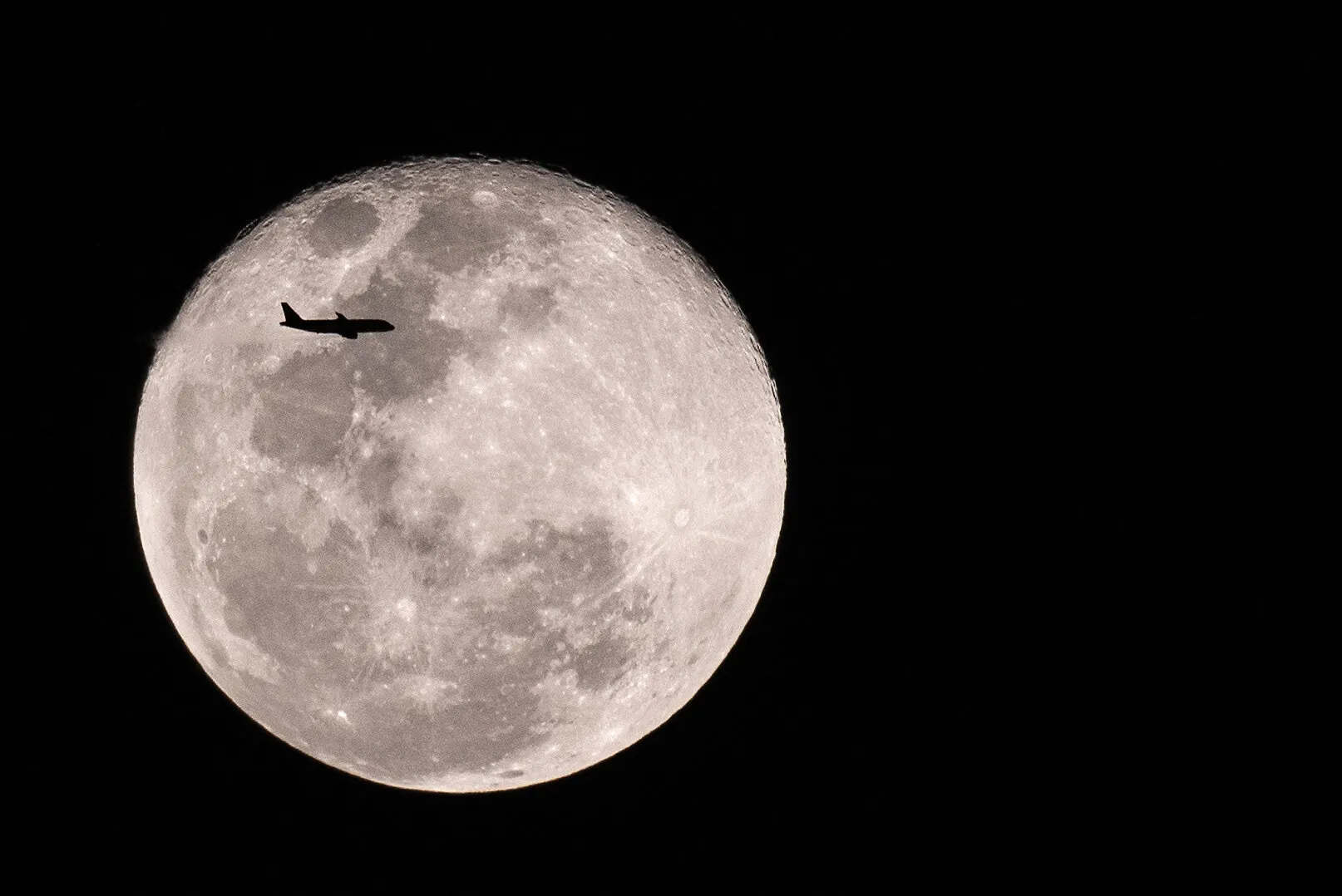 Plane Flying Past Super Blue Blood Moon