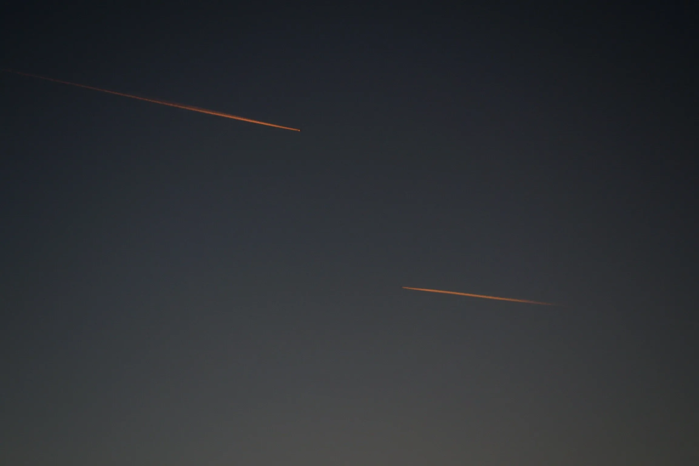 Vapor Trails At Sunset