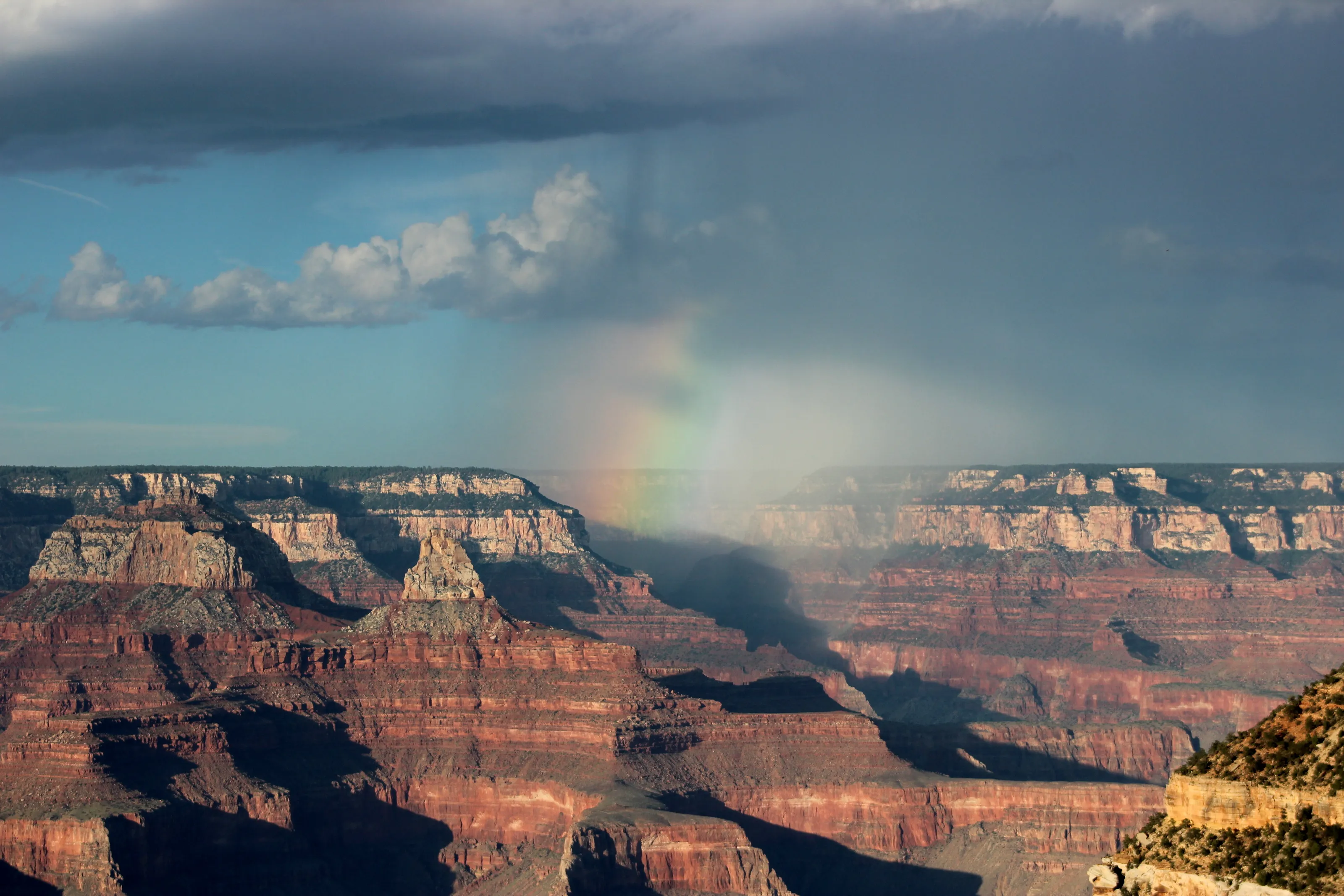 Rainbow and rain clouds over the Grand Canyon National Park, Arizona