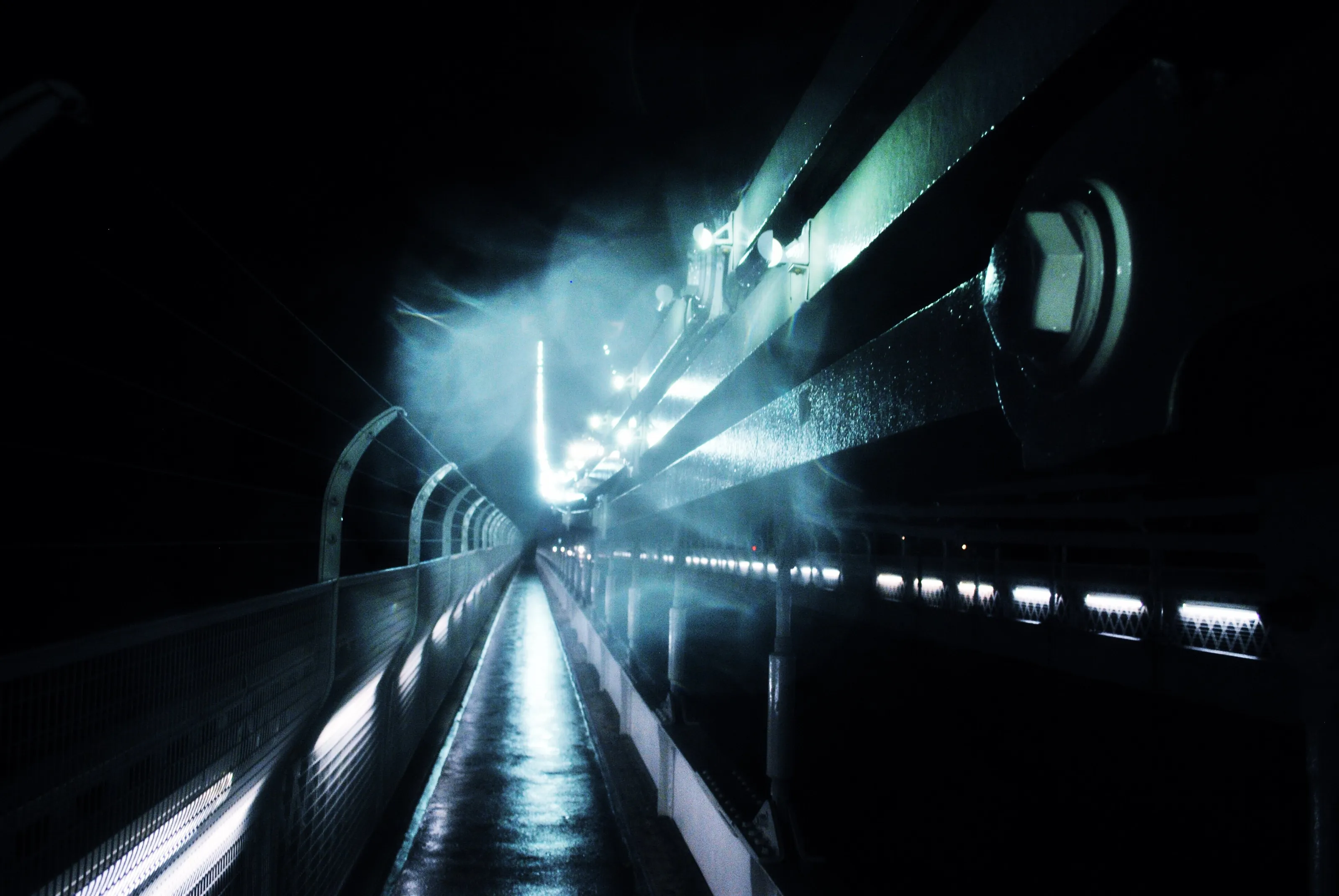Walking along the Suspension Bridge in Fog