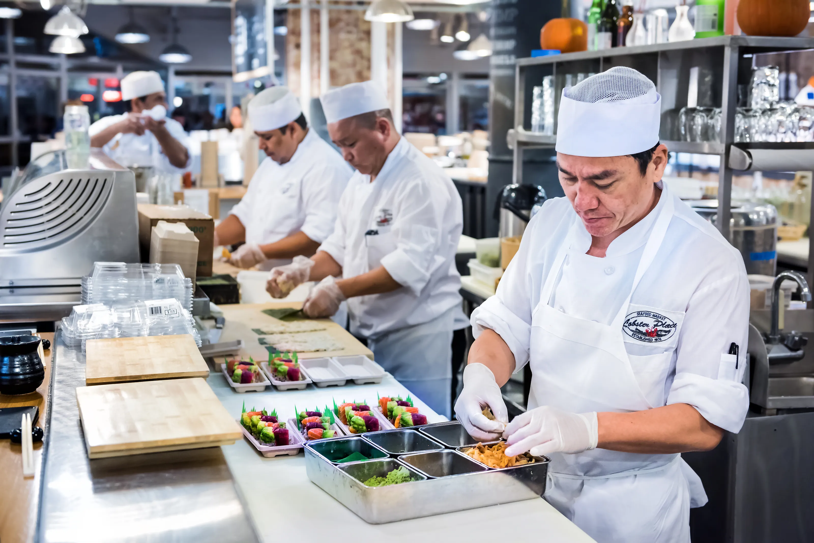Sushi Chefs Preparing a New Batch