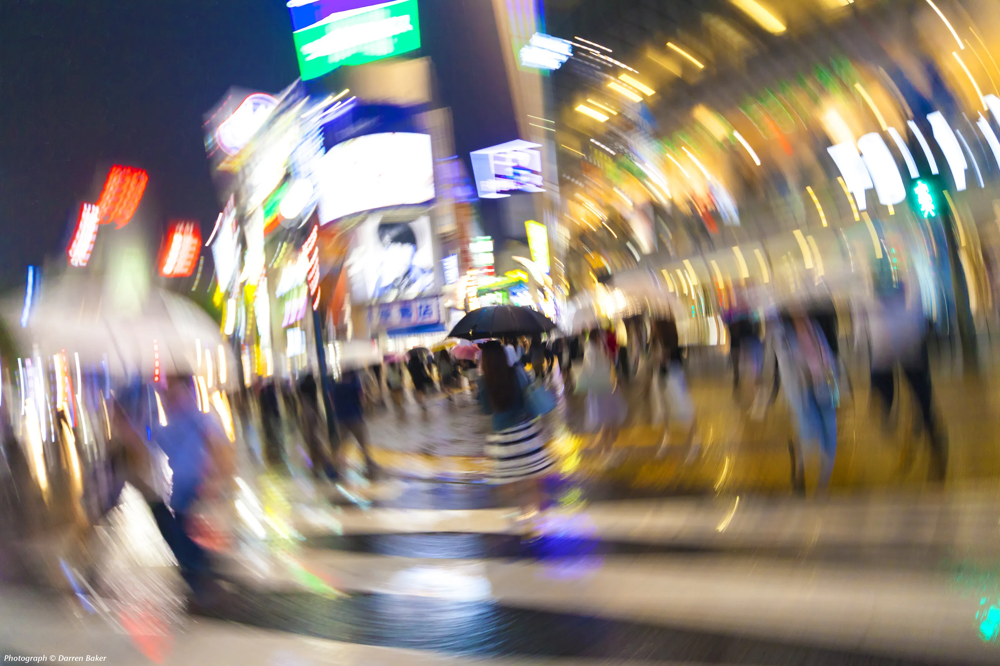 Crossing Tokyo in the Rain