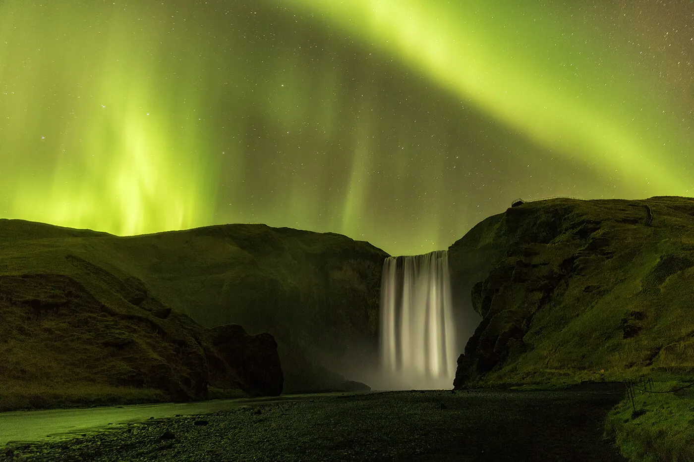 Aurora Borealis over the 200ft Skogafoss Waterfall, Iceland