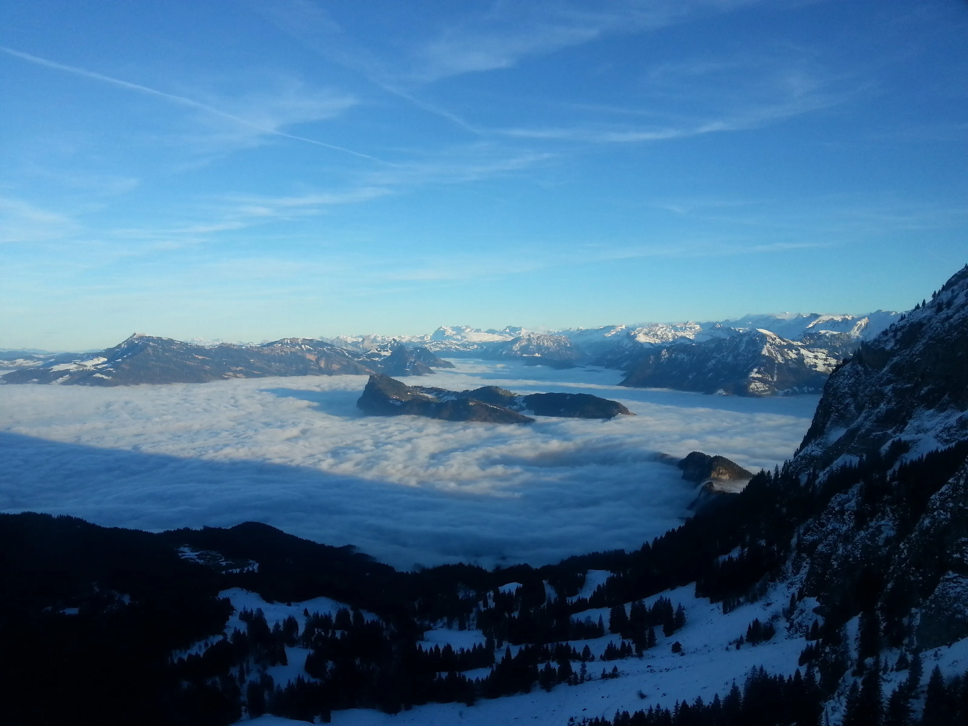 Swiss Alps at Sunset above the clouds