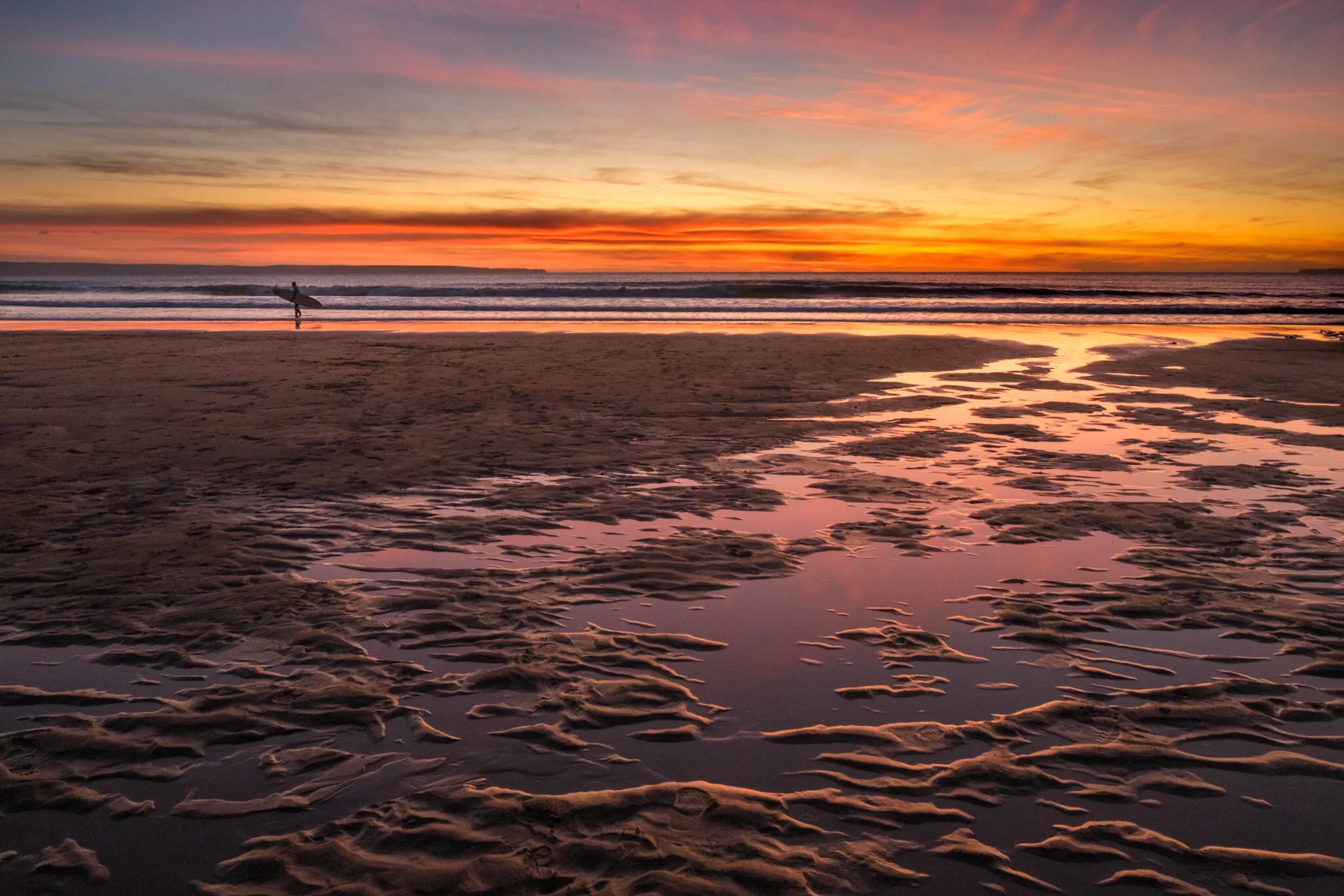 Sunset surfer on Croyde Beach, England