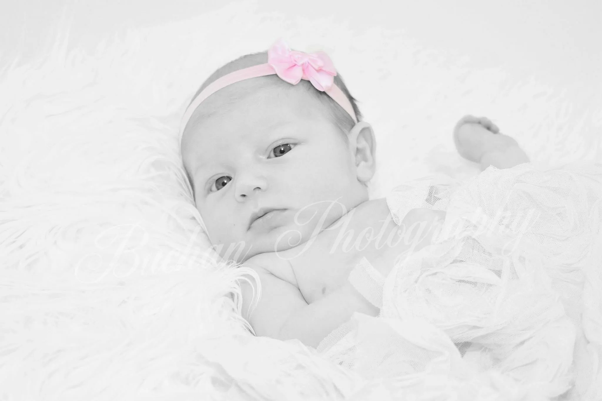 Baby with pink bow