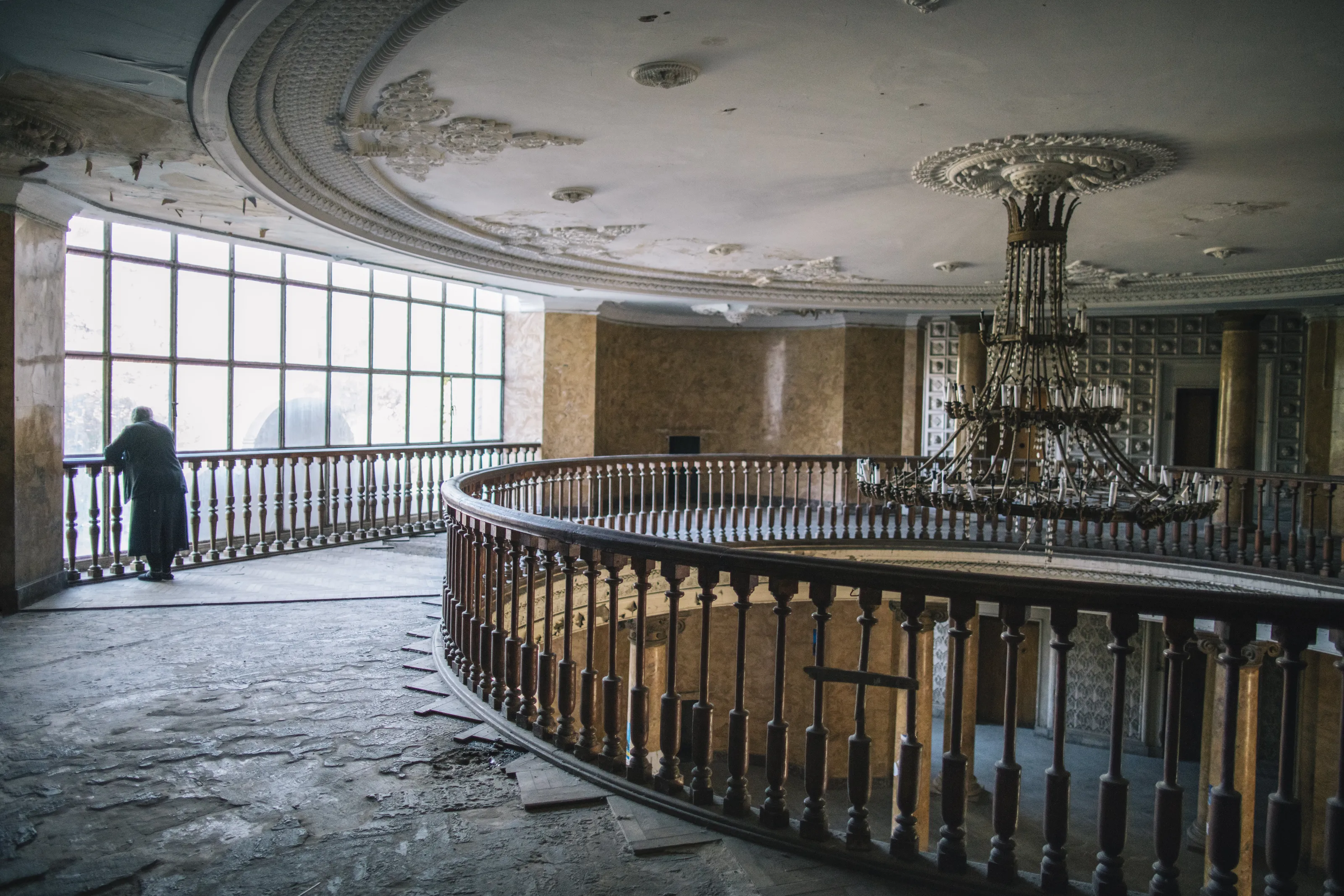 A woman stands in the lobby of former Soviet-era sanatorium 'Rkinigzeli' in Tskaltubo, Georgia