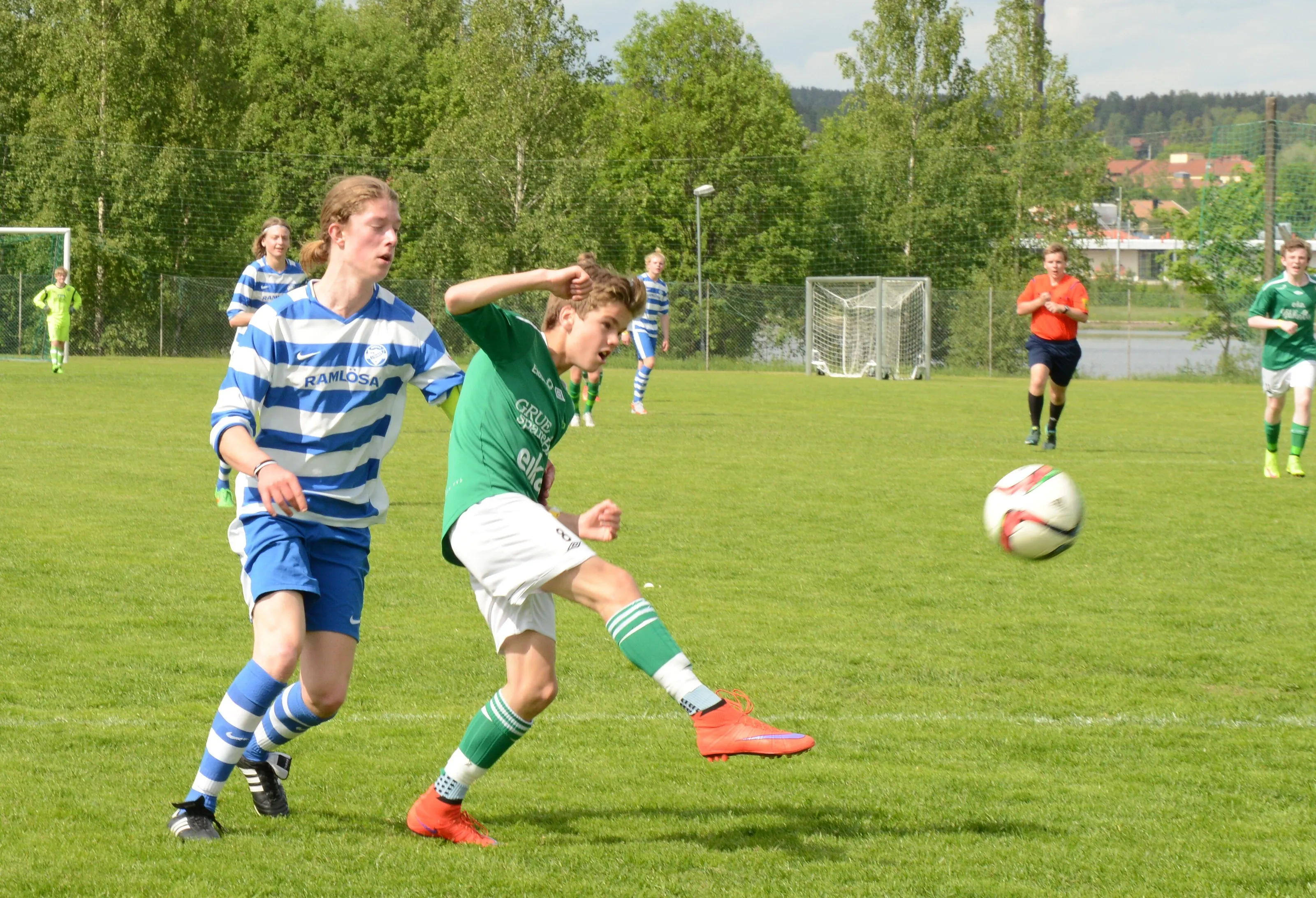 Little boy goes for goal