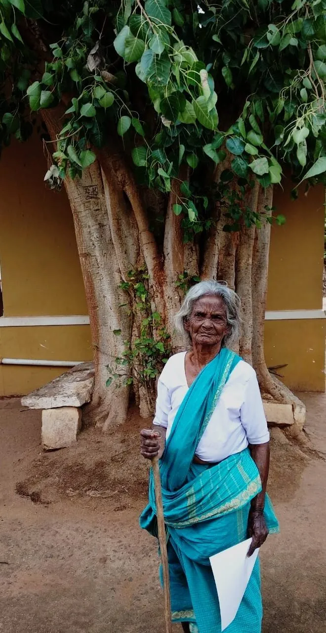 Old lady by the banyan tree