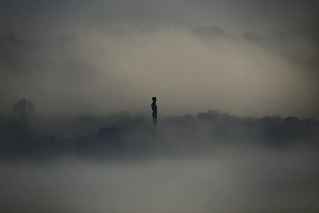 Angel alone in the fog