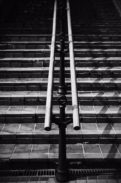 Through the middle of stairs...