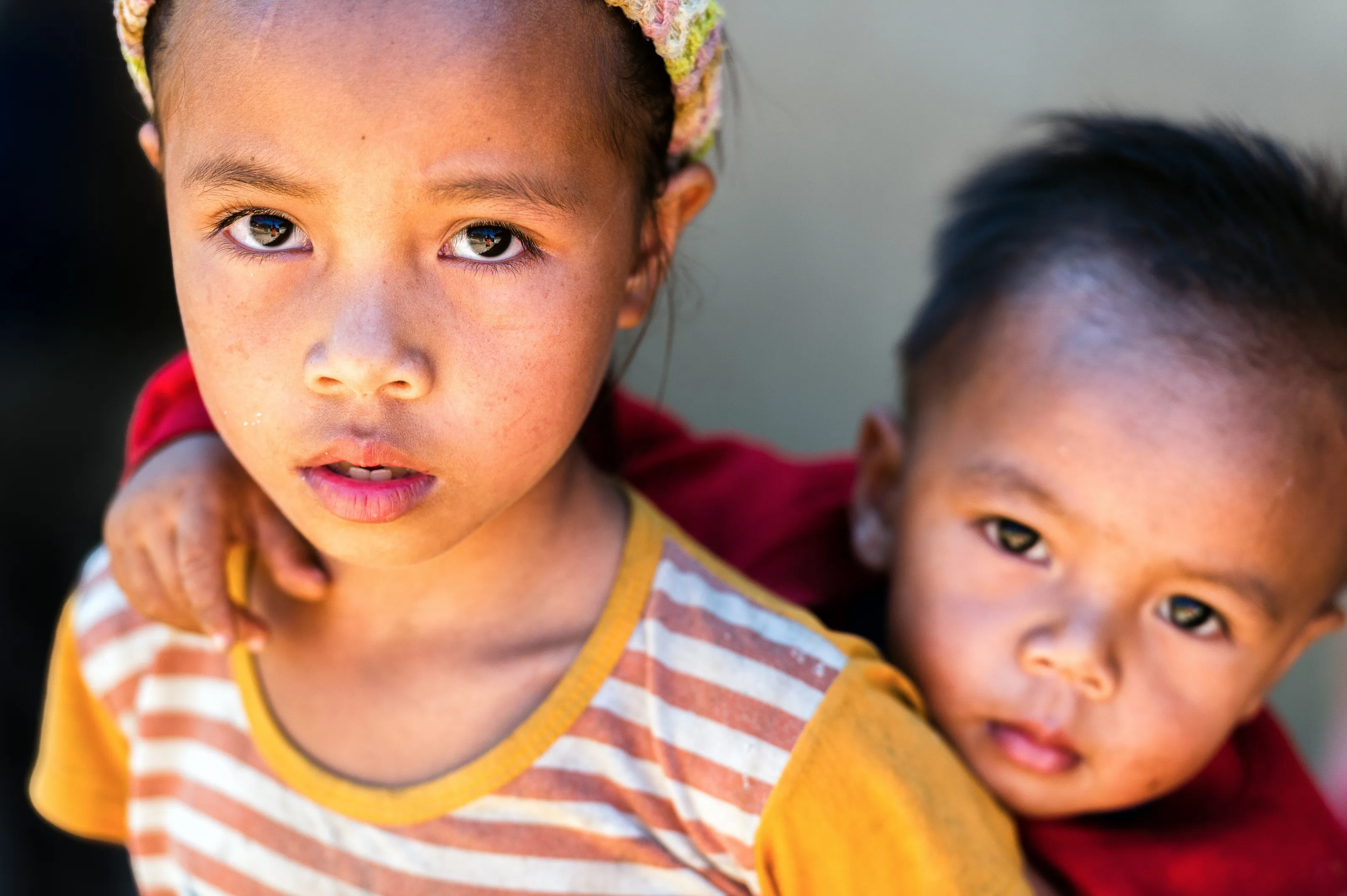 Vang Vieng. Rural village. Portrait of children. Sister and brother