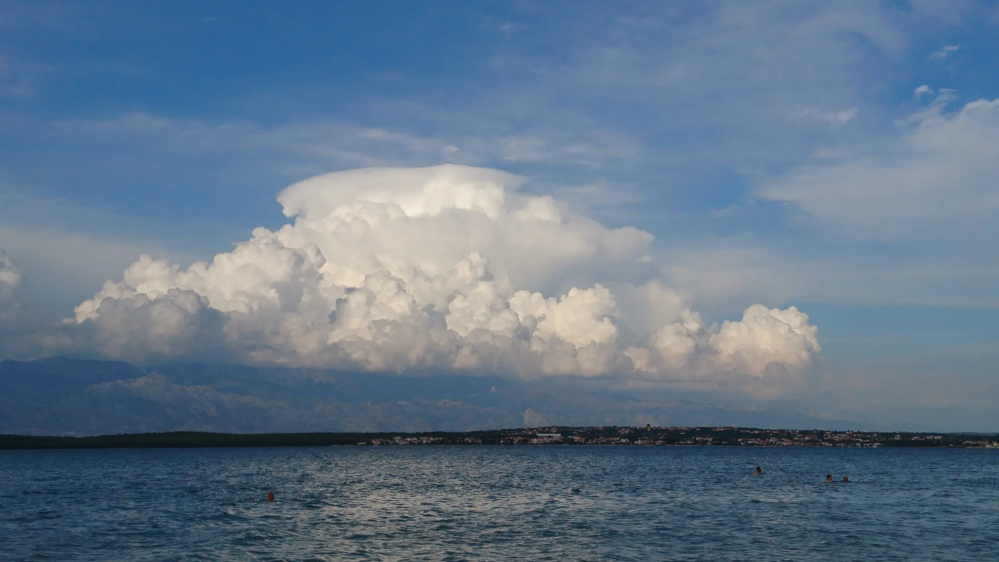 Cloud over the mountain across the beach