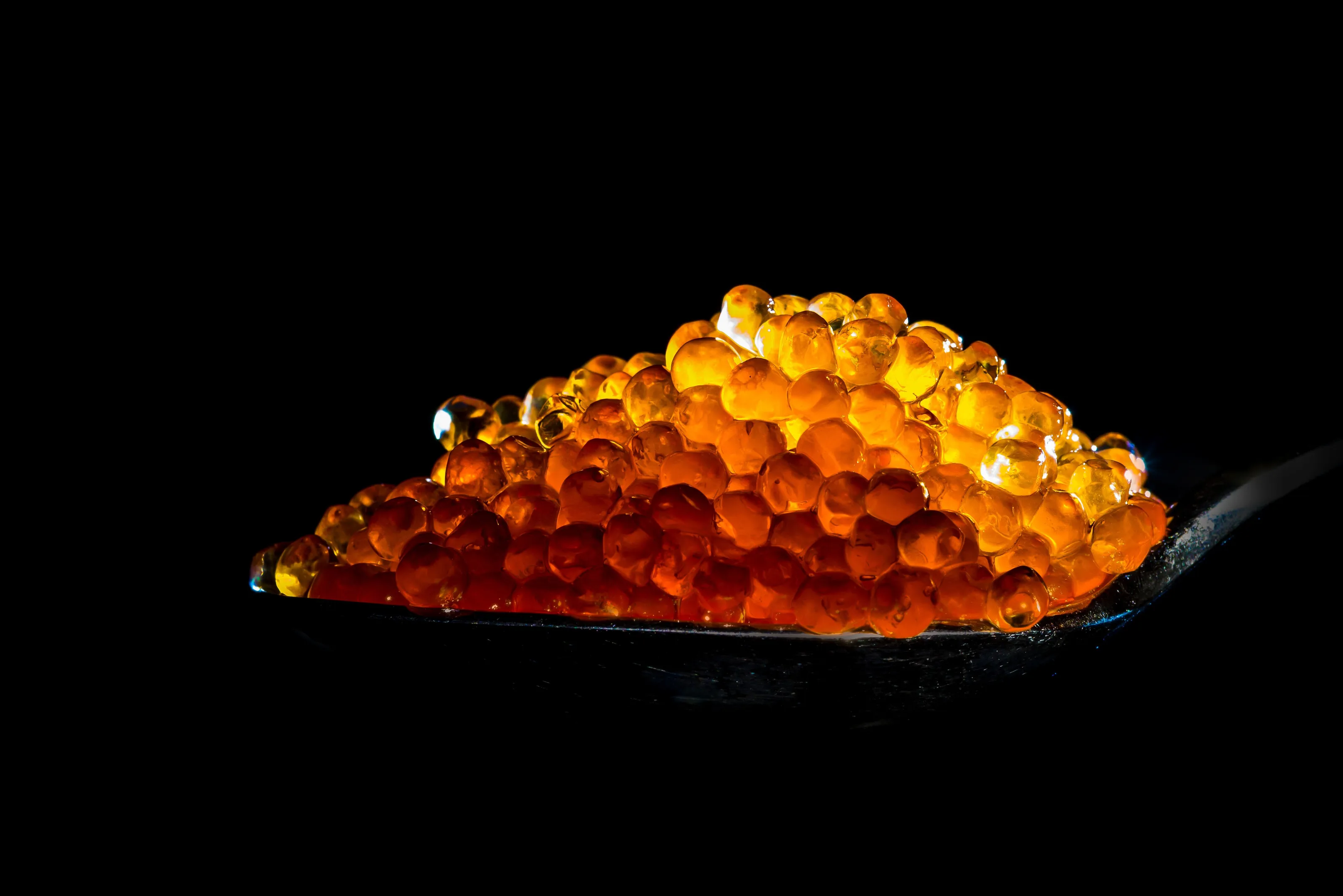 Spoonful of red caviar