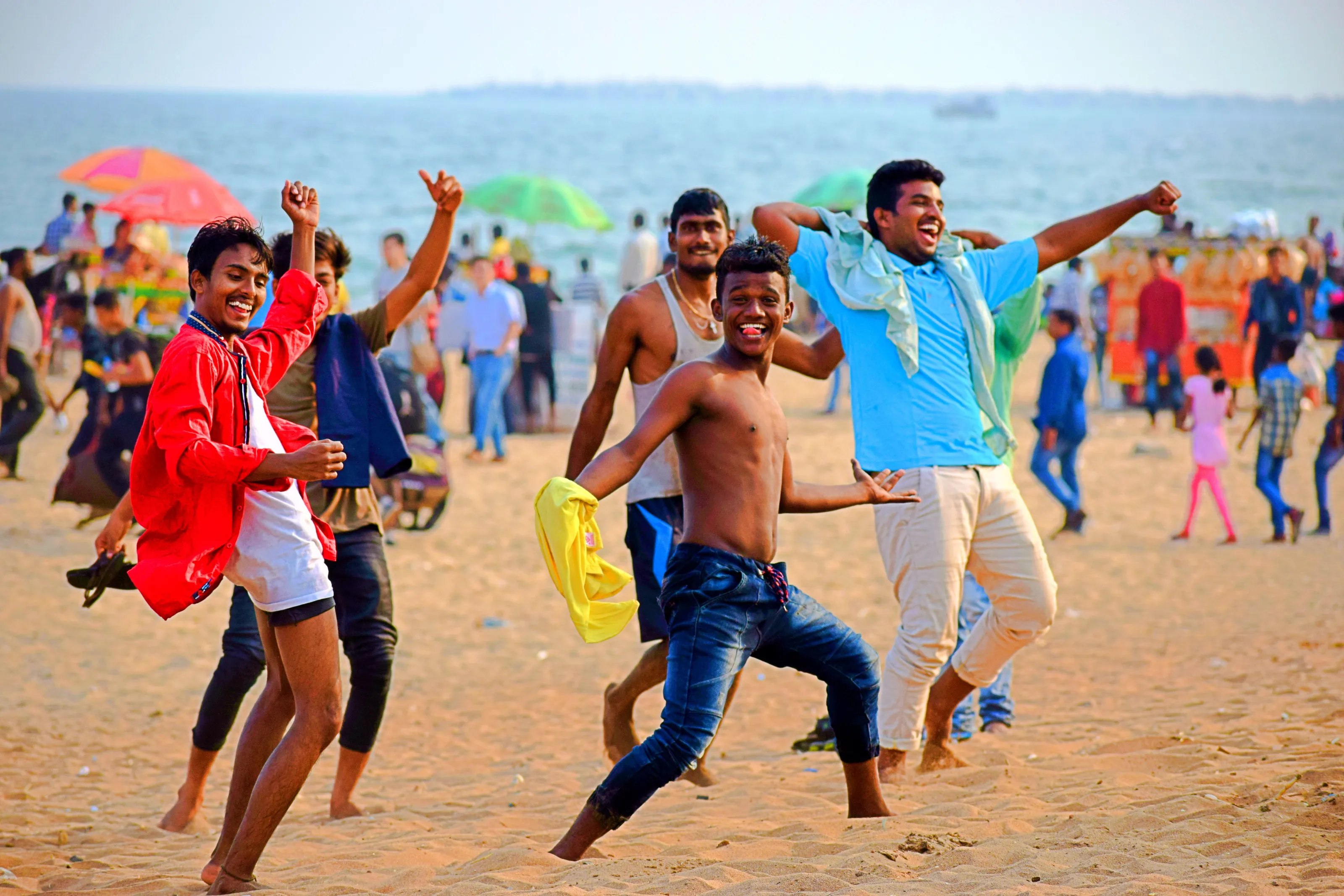Friends dancing & enjoying on the beach