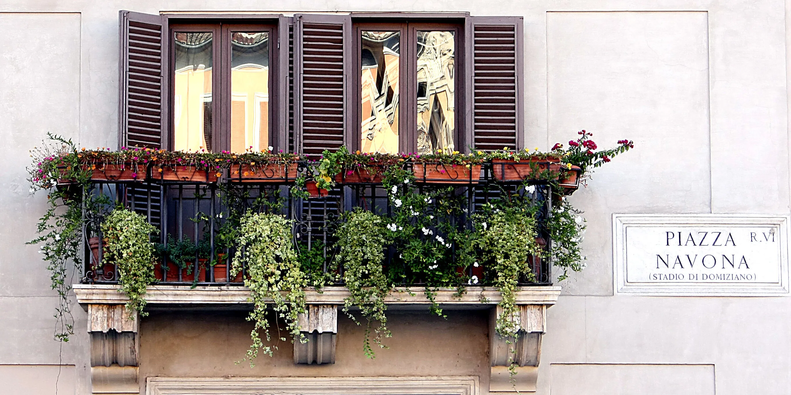 Reflections from a piazza balcony