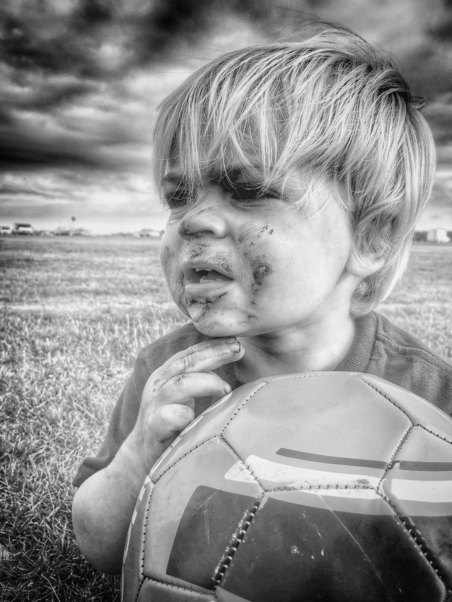 Son playing football.