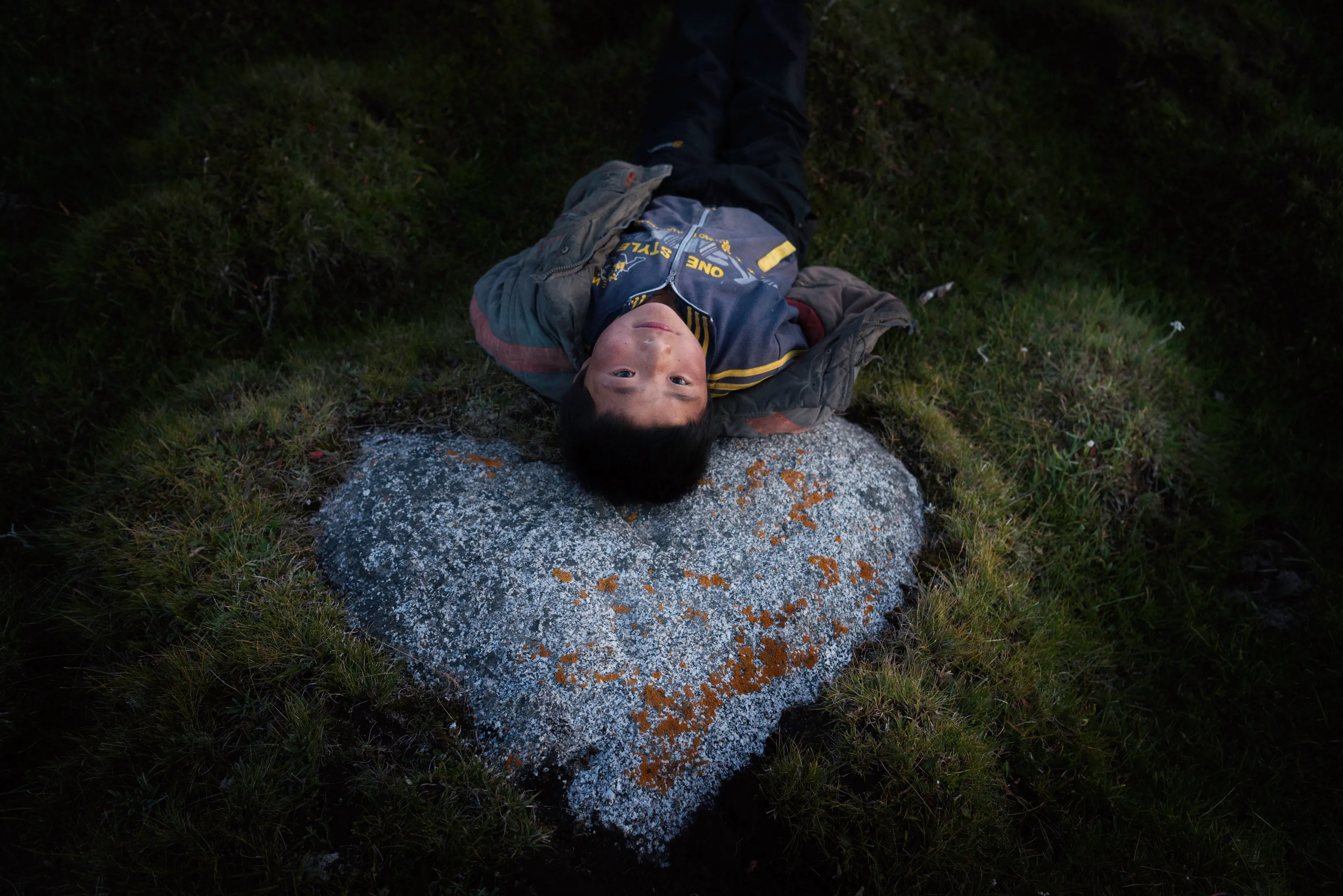 Boy on a rock in the Altai Mountains