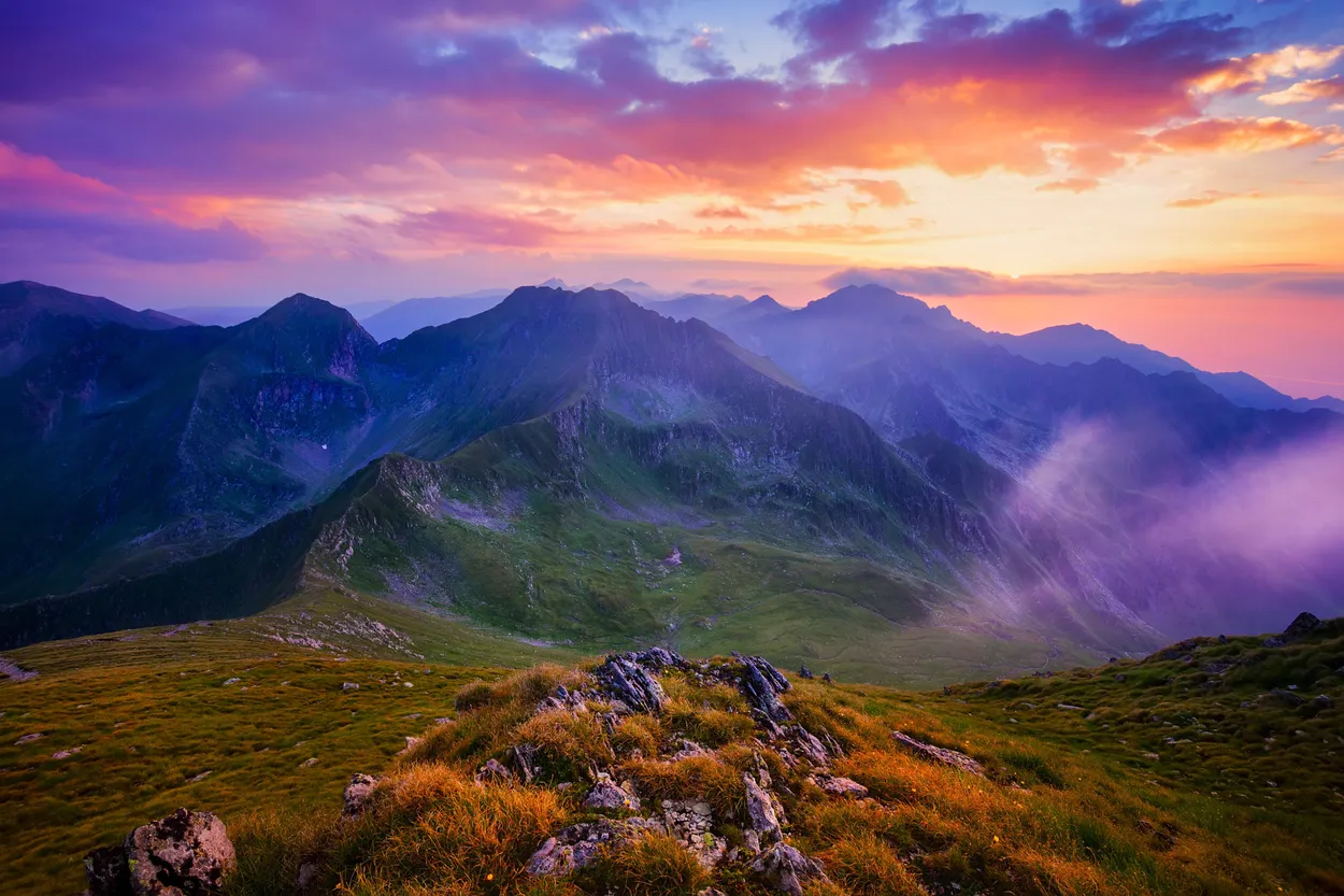 Beautiful sunset with cloudy sky in the Carpathian Mountains in Romania.