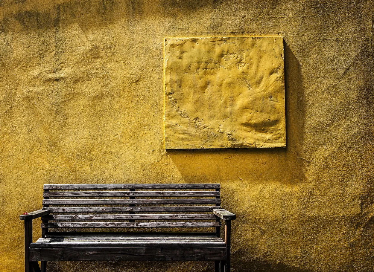 Bench and yellow wall