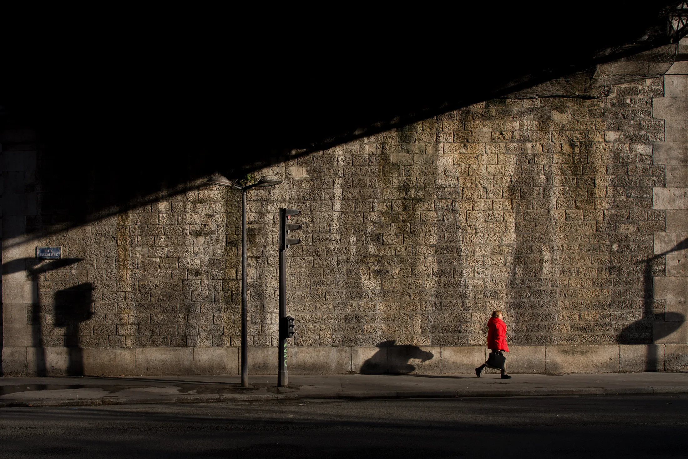 The woman with the red coat