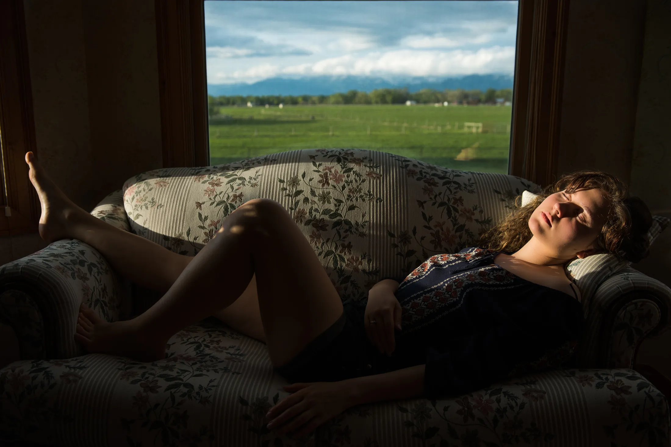 Young woman sleeping on sofa