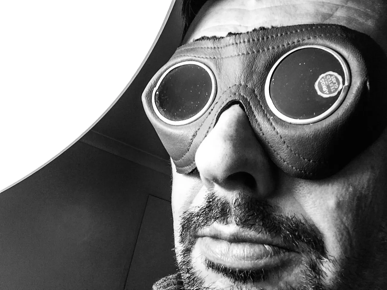 Self-portrait in dark glasses by bright light