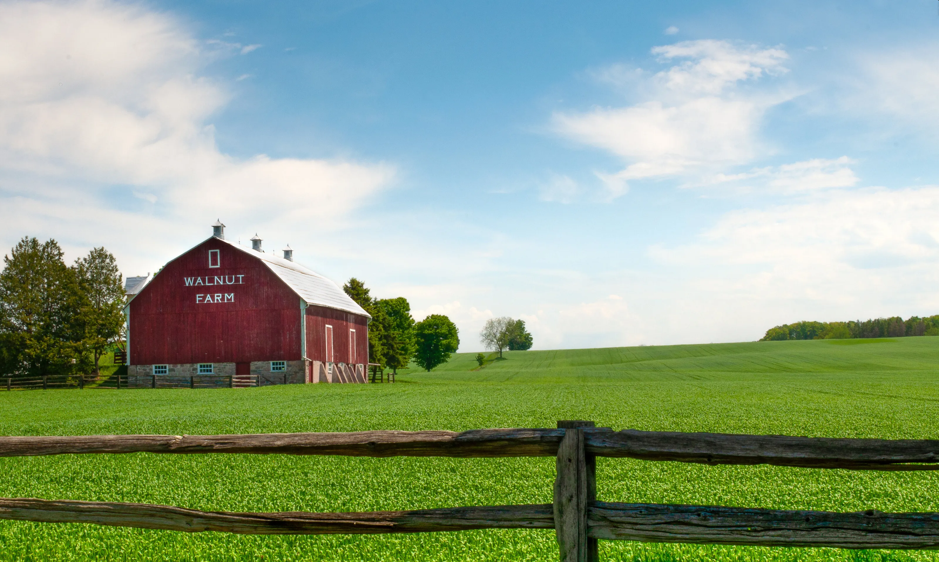 Red barn in the middle of a feild