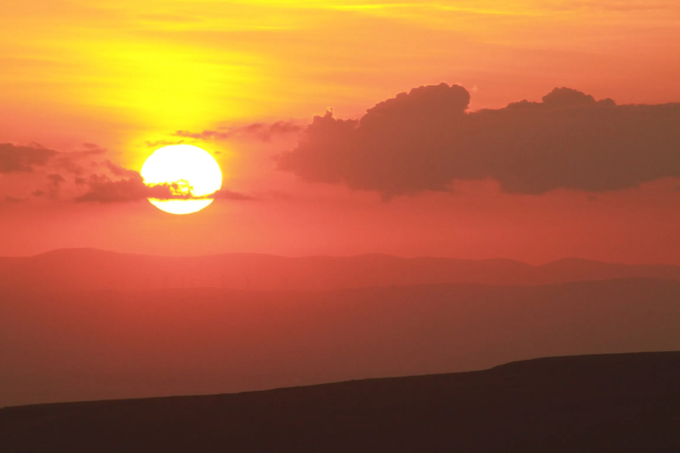 Sunset over distant hills