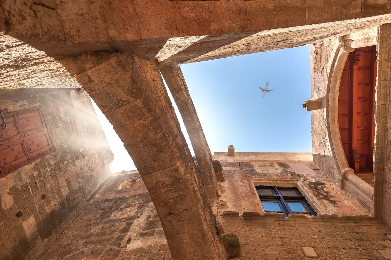 Airplane above Rhodes downtown. Greece.