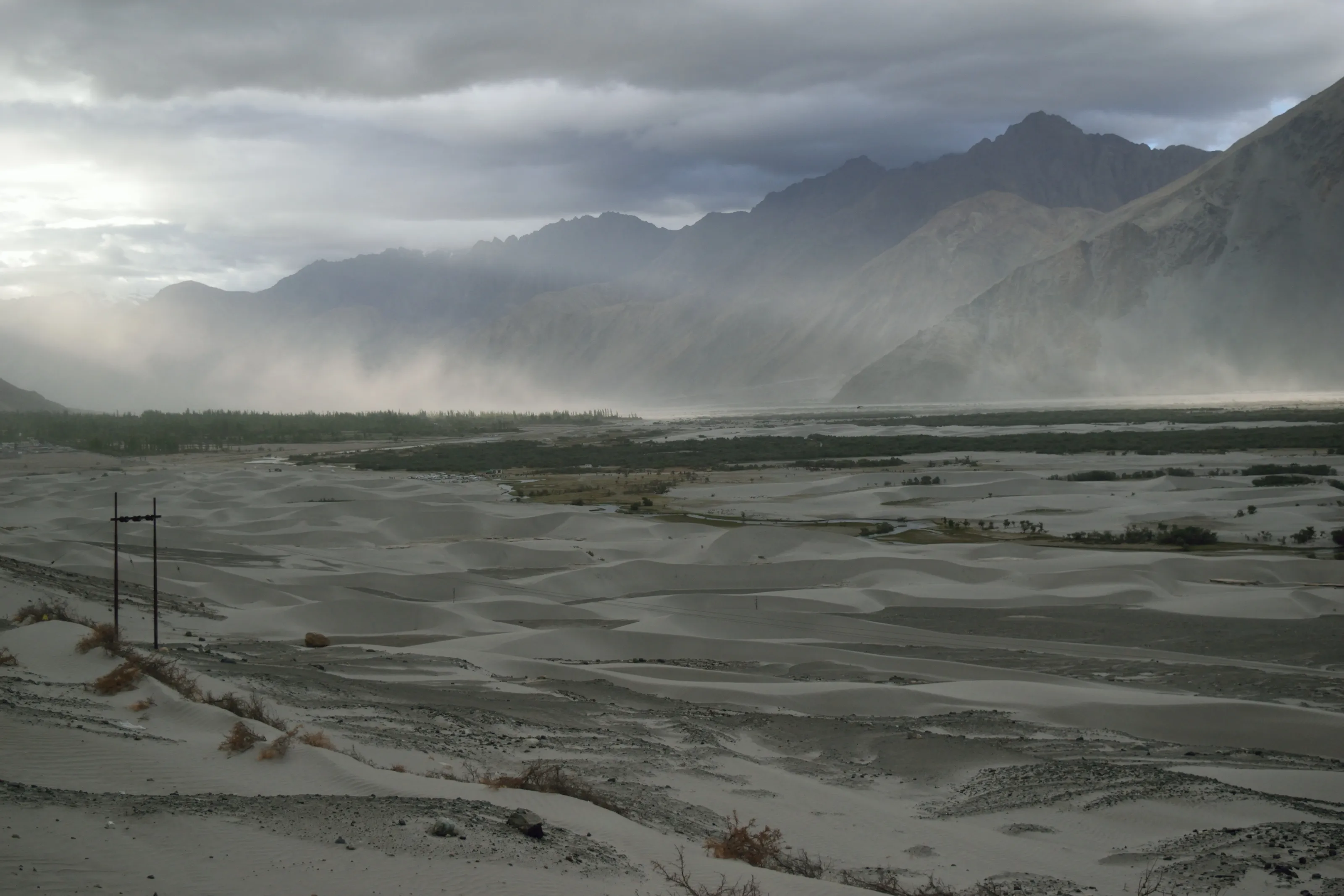 The sun peeps through the clouds after a sandstorm in the Nubra Valley in Ladakh.