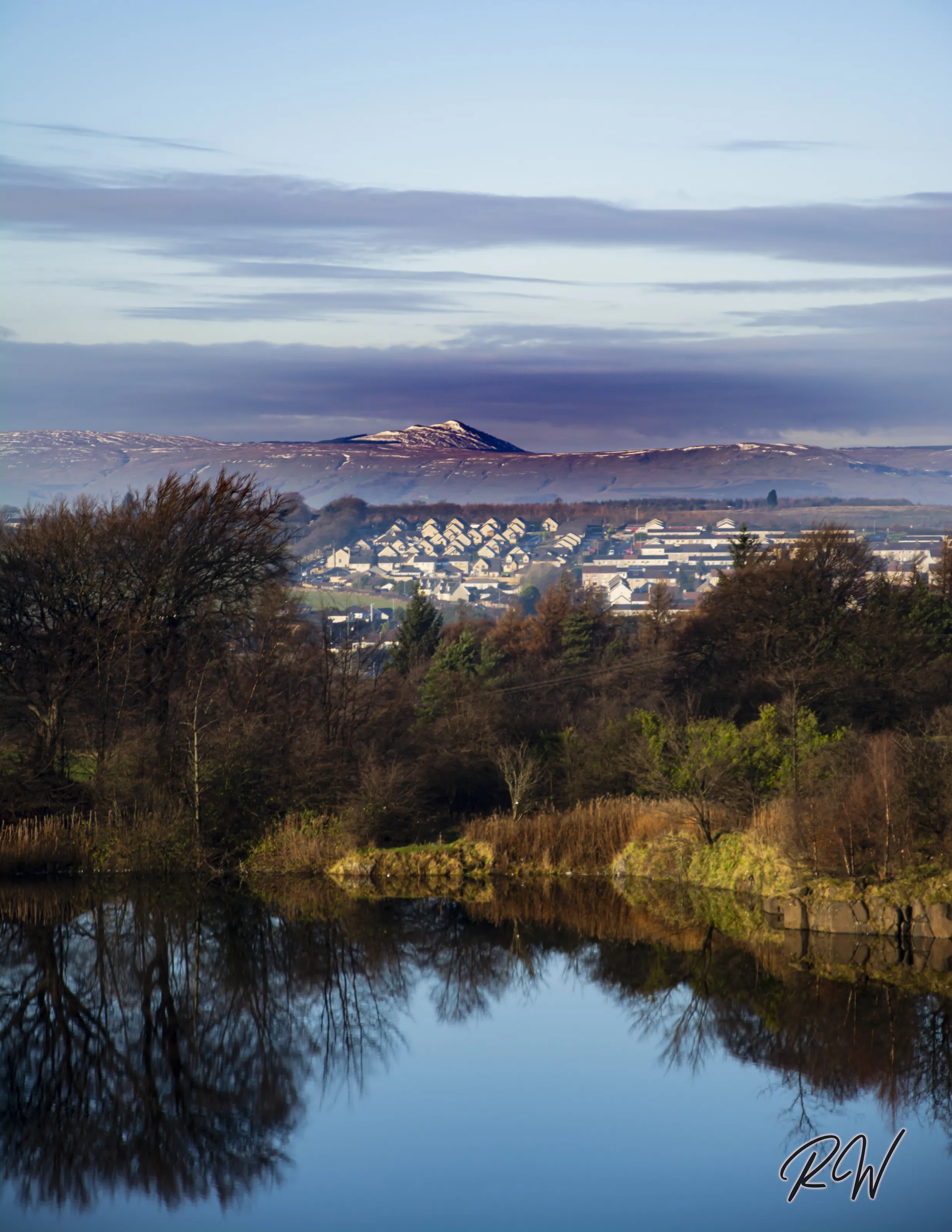 The Campsie's in Scotland With a Small Town Below
