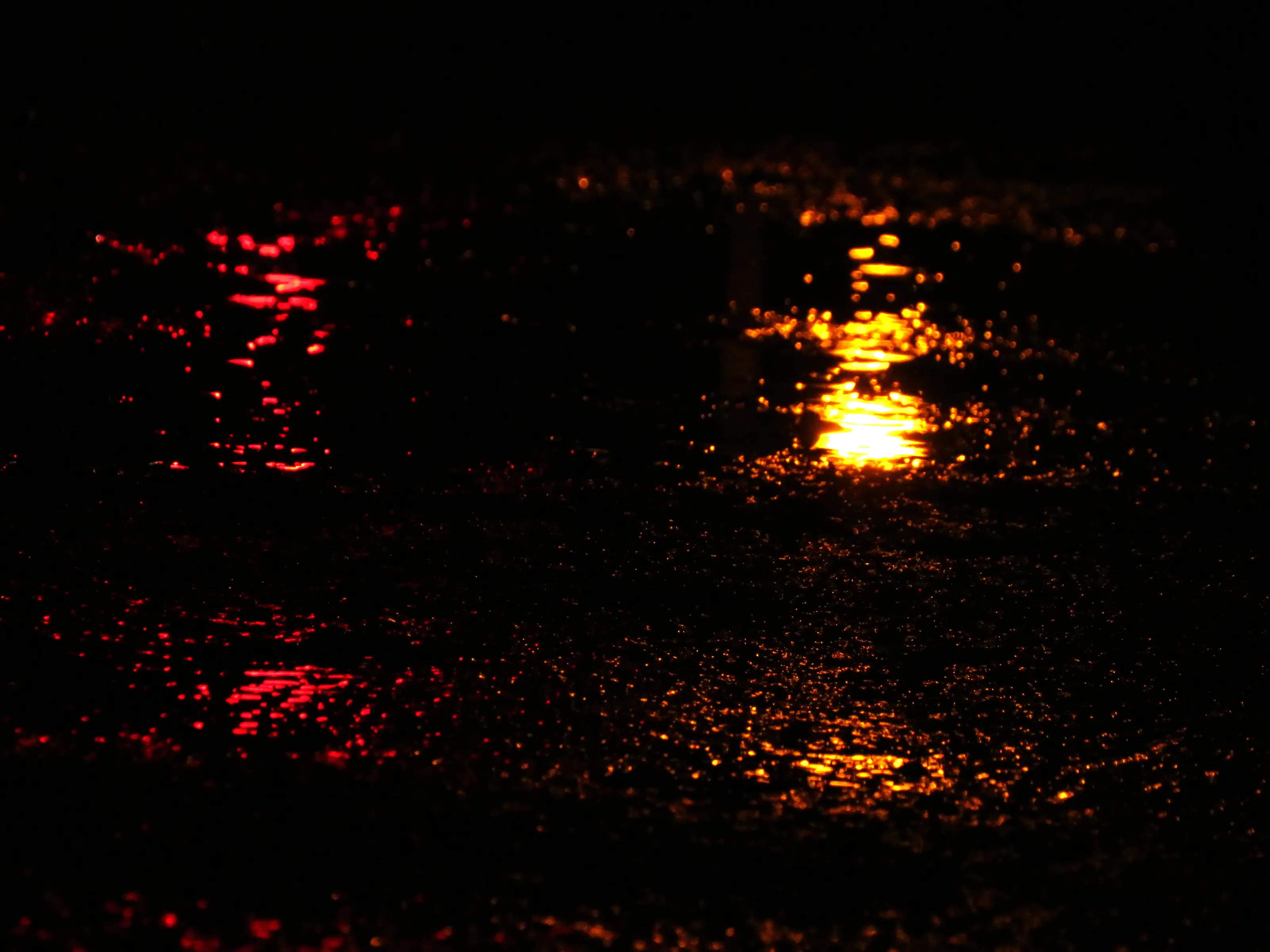 Red light on wet tarmac.