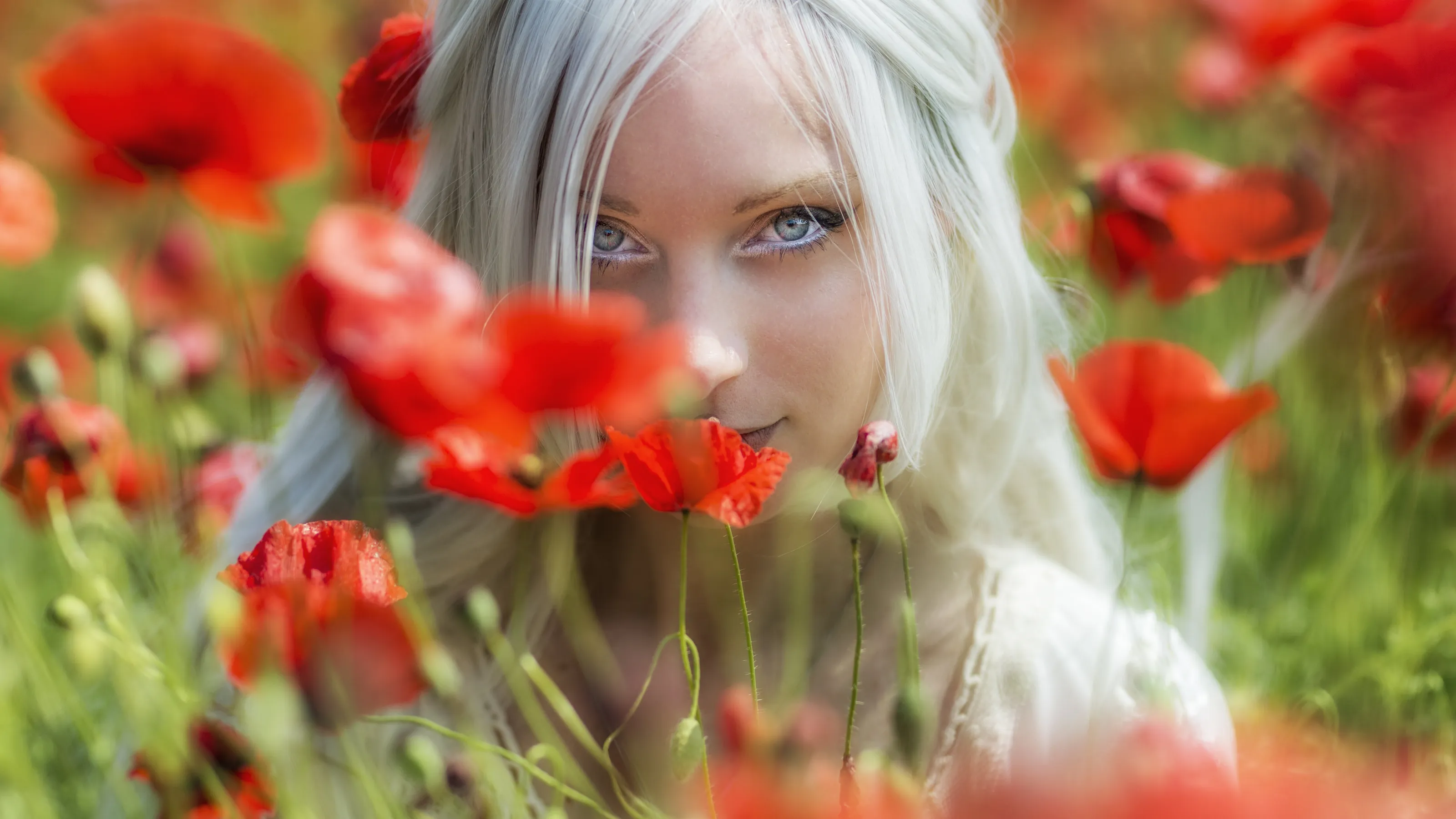 Giulia in a field of poppies